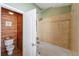 Bathroom with toilet and cedar-lined closet at 8455 Shallow Creek Ct, New Port Richey, FL 34653