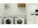 Laundry room with Samsung washer and dryer, and overhead shelving at 8815 Sunset Park Trl, Parrish, FL 34219