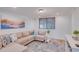 Bright living room featuring an L-shaped sofa and coastal decor at 920 16Th Sw Ave, Largo, FL 33770