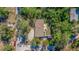 Overhead view of the house, yard, and surrounding landscape at 9615 Xenia St, New Port Richey, FL 34654