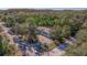 Aerial view showcasing the home's location and surrounding trees at 9615 Xenia St, New Port Richey, FL 34654