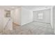 A light and airy bonus room with neutral carpet and crisp white walls offers flexible living space at 10524 Hidden Banks Gln, Parrish, FL 34219