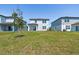A well-manicured lawn extends from the home to the property's edge at 10541 Hidden Banks Gln, Parrish, FL 34219