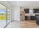 Bright kitchen featuring stainless steel appliances and sliding glass doors at 10541 Hidden Banks Gln, Parrish, FL 34219