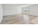 Spacious living area with light hardwood floors and natural light at 10541 Hidden Banks Gln, Parrish, FL 34219