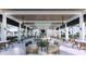 Outdoor covered bar and lounge area with fire pit at 11275 Boundless Ter, Venice, FL 34293