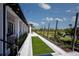 Relaxing walkway with string lights leading to the lake at 12260 Meditation Trl, Venice, FL 34293