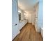 Spacious bathroom featuring double sinks, wooden floors, and modern fixtures at 13400 Haflinger Way, Hudson, FL 34667