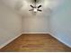 Spacious bedroom featuring wood-look floors, recessed lighting and a ceiling fan at 13400 Haflinger Way, Hudson, FL 34667