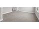Spacious bedroom with grey carpet and an open feel at 1532 Gopher Loop, Tarpon Springs, FL 34689