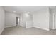 Upstairs bedroom with carpet and access to a hallway at 1532 Gopher Loop, Tarpon Springs, FL 34689