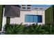 Aerial view of a modern rectangular pool, lush greenery, and a patio, providing a luxurious outdoor space at 1532 Gopher Loop, Tarpon Springs, FL 34689