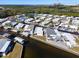 Aerial view of waterfront community with mobile homes and boat docks at 162 S Saint Thomas Cir, Apollo Beach, FL 33572