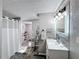 Clean bathroom with walk-in shower, updated vanity, and new flooring at 162 S Saint Thomas Cir, Apollo Beach, FL 33572