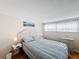 Bedroom with a double bed, nightstands, and wall art at 162 S Saint Thomas Cir, Apollo Beach, FL 33572