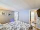 Spacious bedroom with king bed, access to bathroom and hallway at 162 S Saint Thomas Cir, Apollo Beach, FL 33572