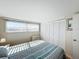 Bedroom with double bed, large closet, and window with blinds at 162 S Saint Thomas Cir, Apollo Beach, FL 33572