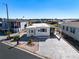 Single-wide home with covered carport and paved driveway at 162 S Saint Thomas Cir, Apollo Beach, FL 33572
