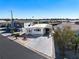 Single-wide home with covered carport and paved driveway at 162 S Saint Thomas Cir, Apollo Beach, FL 33572