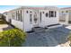 Quaint single-wide home with sunburst design and inviting front entrance at 162 S Saint Thomas Cir, Apollo Beach, FL 33572