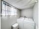 Laundry room with washer, dryer, and storage space at 162 S Saint Thomas Cir, Apollo Beach, FL 33572