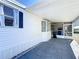 Covered patio with stone flooring next to the house at 162 S Saint Thomas Cir, Apollo Beach, FL 33572