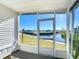 Relaxing screened porch overlooking the canal at 162 S Saint Thomas Cir, Apollo Beach, FL 33572