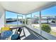 Waterfront screened porch with seating and canal views at 162 S Saint Thomas Cir, Apollo Beach, FL 33572