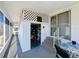 Covered porch with access to storage and stairs at 162 S Saint Thomas Cir, Apollo Beach, FL 33572