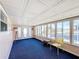 Sunroom with ample natural light and blue carpeting at 162 S Saint Thomas Cir, Apollo Beach, FL 33572