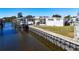 White mobile home on the waterfront with a boat lift at 162 S Saint Thomas Cir, Apollo Beach, FL 33572