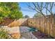 Backyard patio area with wooden fence at 1626 Roundtree Rd, Holiday, FL 34690