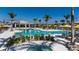 Community pool with spa and plenty of lounge chairs at 17778 Solstice Ave, Venice, FL 34293