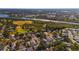 Aerial view of community near water, showing homes and green space at 2044 Sheffield Ct, Oldsmar, FL 34677