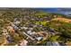 Aerial view of community near the water, showing homes and green space at 2044 Sheffield Ct, Oldsmar, FL 34677