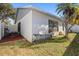 View of home's exterior and backyard patio at 2044 Sheffield Ct, Oldsmar, FL 34677