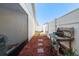 Small backyard with patio furniture and garden area at 2044 Sheffield Ct, Oldsmar, FL 34677