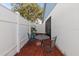 Small backyard with patio set and privacy fence at 2044 Sheffield Ct, Oldsmar, FL 34677