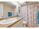 Clean bathroom with updated vanity, shower, and patterned curtain at 2044 Sheffield Ct, Oldsmar, FL 34677