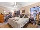 Main bedroom with king bed, dresser, and ceiling fan at 2044 Sheffield Ct, Oldsmar, FL 34677
