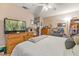 Main bedroom with king bed, dresser, and ceiling fan at 2044 Sheffield Ct, Oldsmar, FL 34677