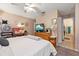Main bedroom with king bed, dresser, and en-suite bathroom at 2044 Sheffield Ct, Oldsmar, FL 34677