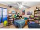 bedroom with twin bed, bookshelves, and toys at 2044 Sheffield Ct, Oldsmar, FL 34677