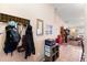 Entryway with coat rack and view into living room at 2044 Sheffield Ct, Oldsmar, FL 34677