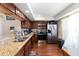 Modern kitchen with granite countertops and stainless steel appliances at 2044 Sheffield Ct, Oldsmar, FL 34677