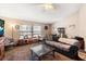 Spacious living room with a gray couch and glass coffee table at 2044 Sheffield Ct, Oldsmar, FL 34677