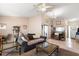Open living room, dining area, and kitchen with a gray couch at 2044 Sheffield Ct, Oldsmar, FL 34677