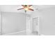 Bedroom with ceiling fan, closet, and access to another room at 2610 Rosehaven Dr, Wesley Chapel, FL 33544