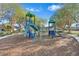 playground with play structures and woodchips at 2610 Rosehaven Dr, Wesley Chapel, FL 33544