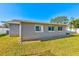 Rear exterior view of the house showcasing the landscaping at 3201 61St N St, St Petersburg, FL 33710